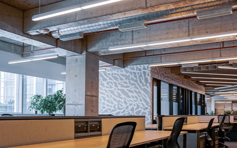 Empty office space with suspended LED linear lighting