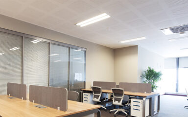 Commercial office space with office furniture and LED Troffer lights
