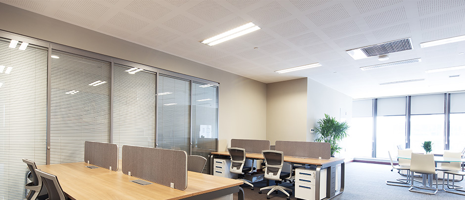 Commercial office space with office furniture and LED Troffer lights