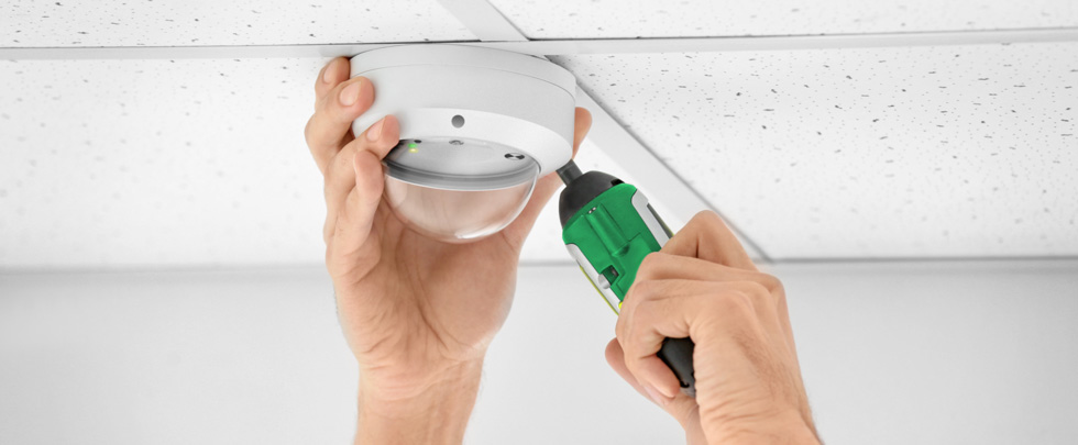 Ledfire Dome in ceiling being installed with screwdriver